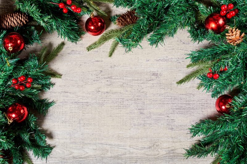 Christmas garland with red ornaments and pine cones