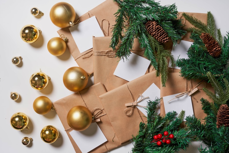 Christmas gifts with ornaments and pine cones
