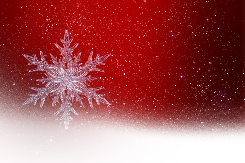 Snowflake on a red background with glitter