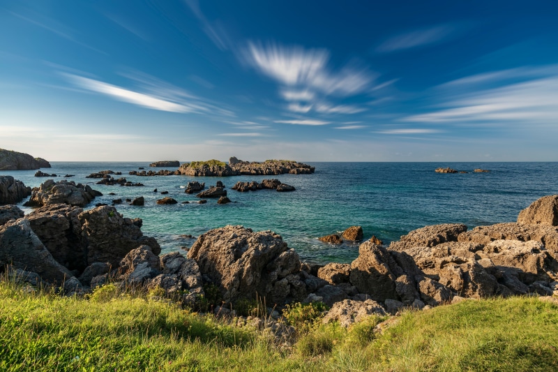 Rocky coast of Cantabria, Spain under a blue sky