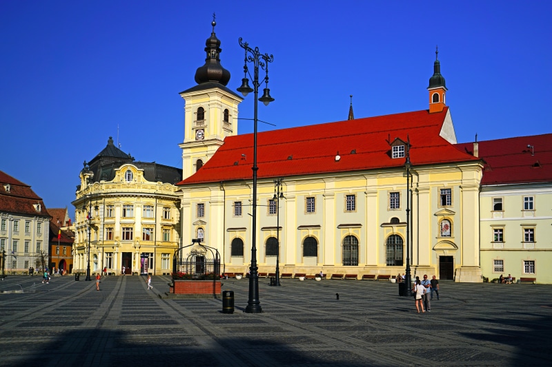Town square in Sibiu, Romania with historic buildings