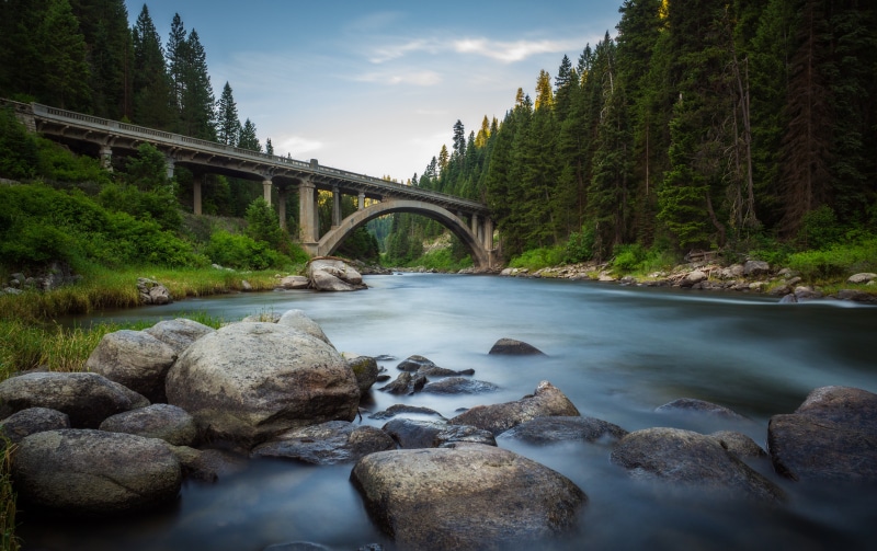Rainbow Bridge over a River in USA Forests