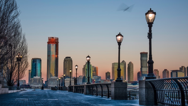 New York City skyline with street lights at dusk