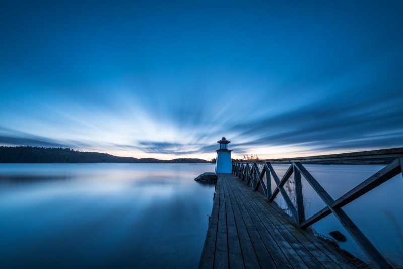 Lighthouse on a pier in Sweden at dusk