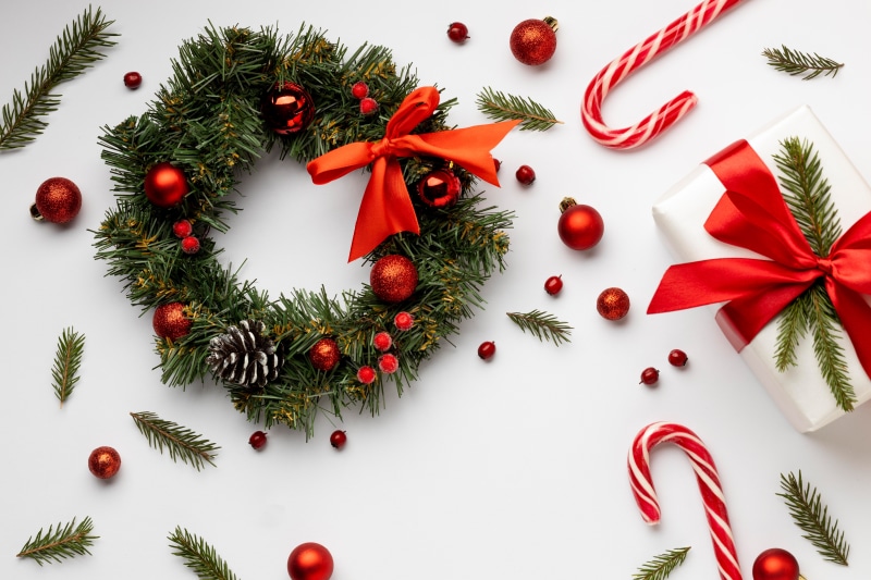 Christmas wreath with ornaments, gift, and candy canes