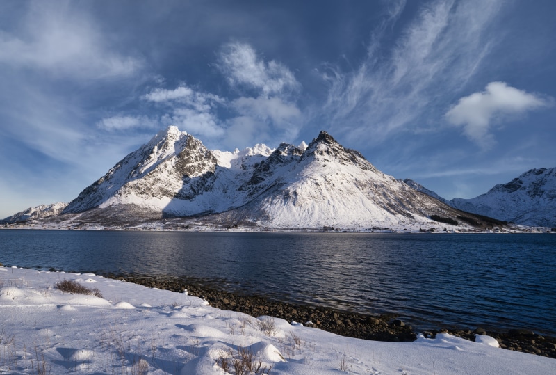 Snowy Mountains over a Lake in Laupstad, Norway