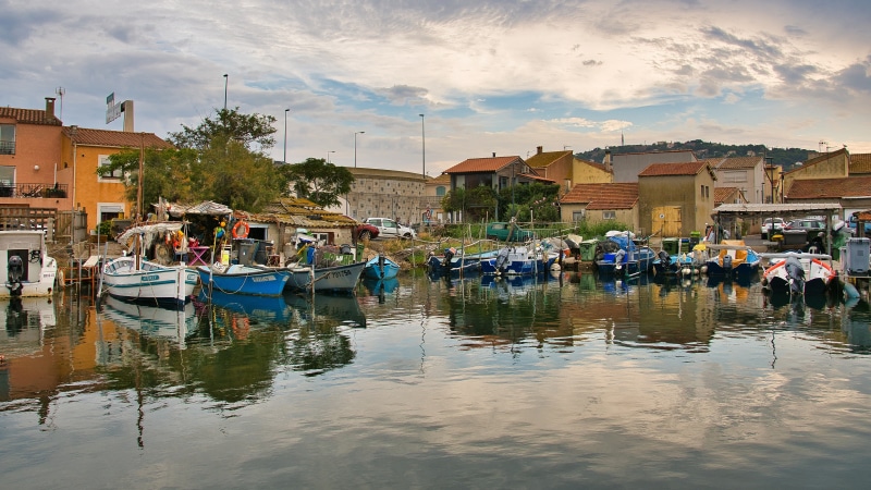 Boats docked in a canal in Sete, France