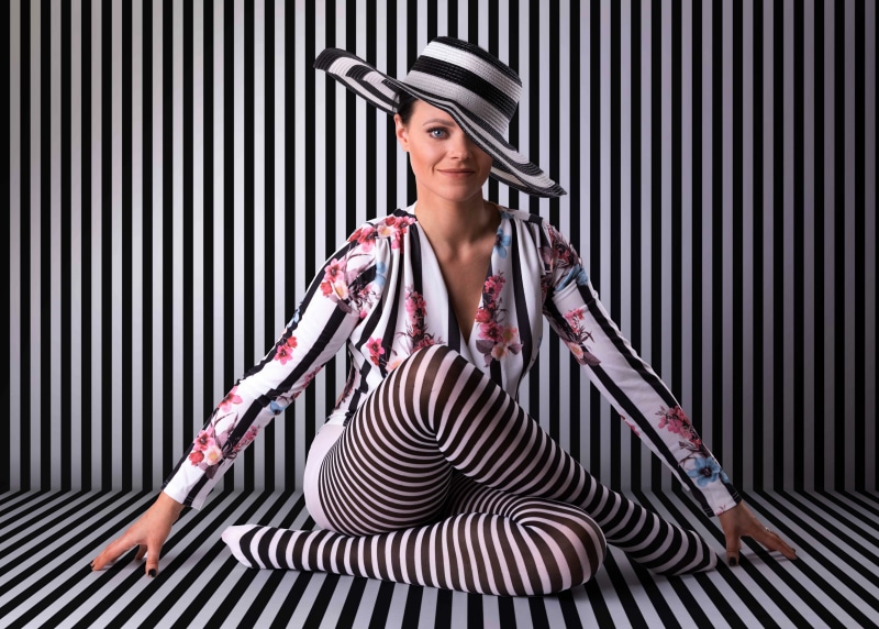 Hannah sitting with striped hat and pantyhose