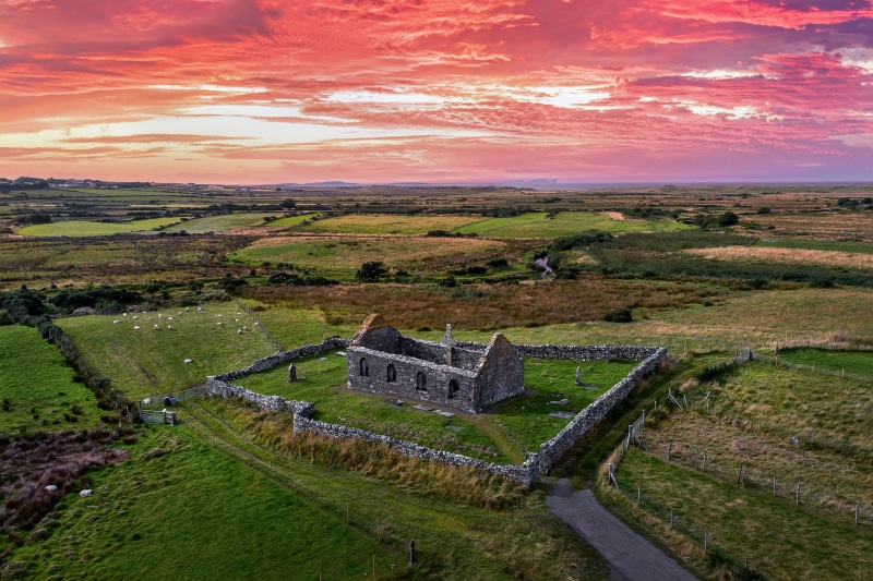Ruins of Ray Church in Ireland at sunset