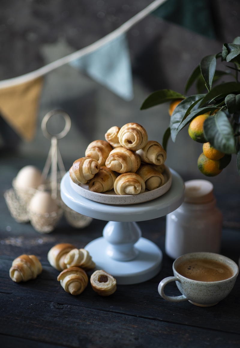 Croissants and coffee on a dark wooden table