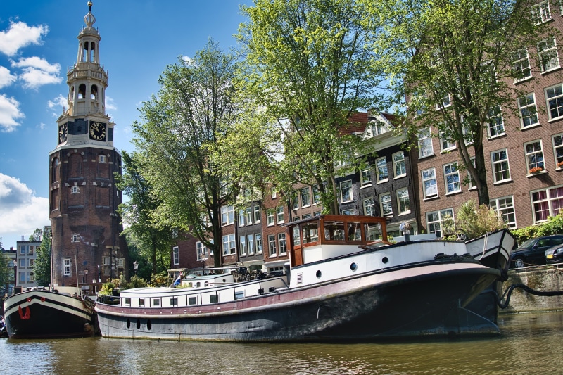 Amsterdam Canal with Westerkerk Tower and Houseboats