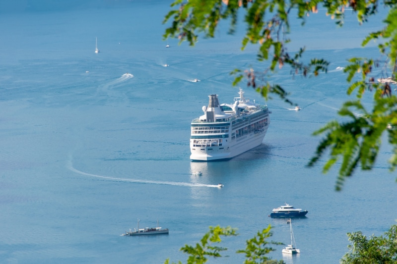 Rhapsody of the Seas cruise liner on the sea with motorboats