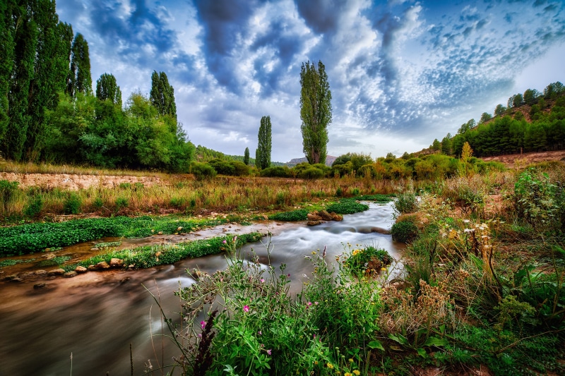 4K Nerpio Spain River with Trees and Clouds