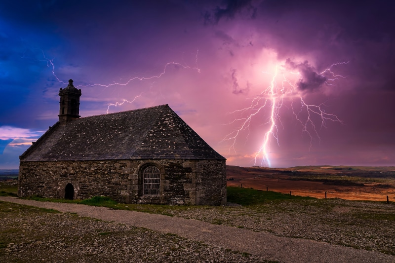 Stone building with lightning strike in Bretagne, France