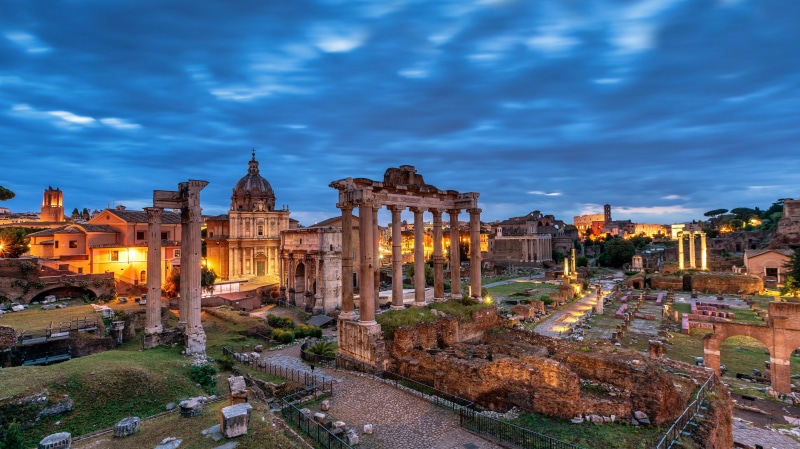 Roman Forum ruins in Rome, Italy at dusk