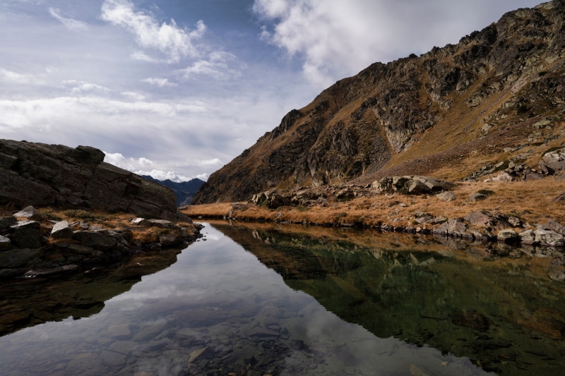 Mountain lake reflection in Ordino Arcalis, Andorra