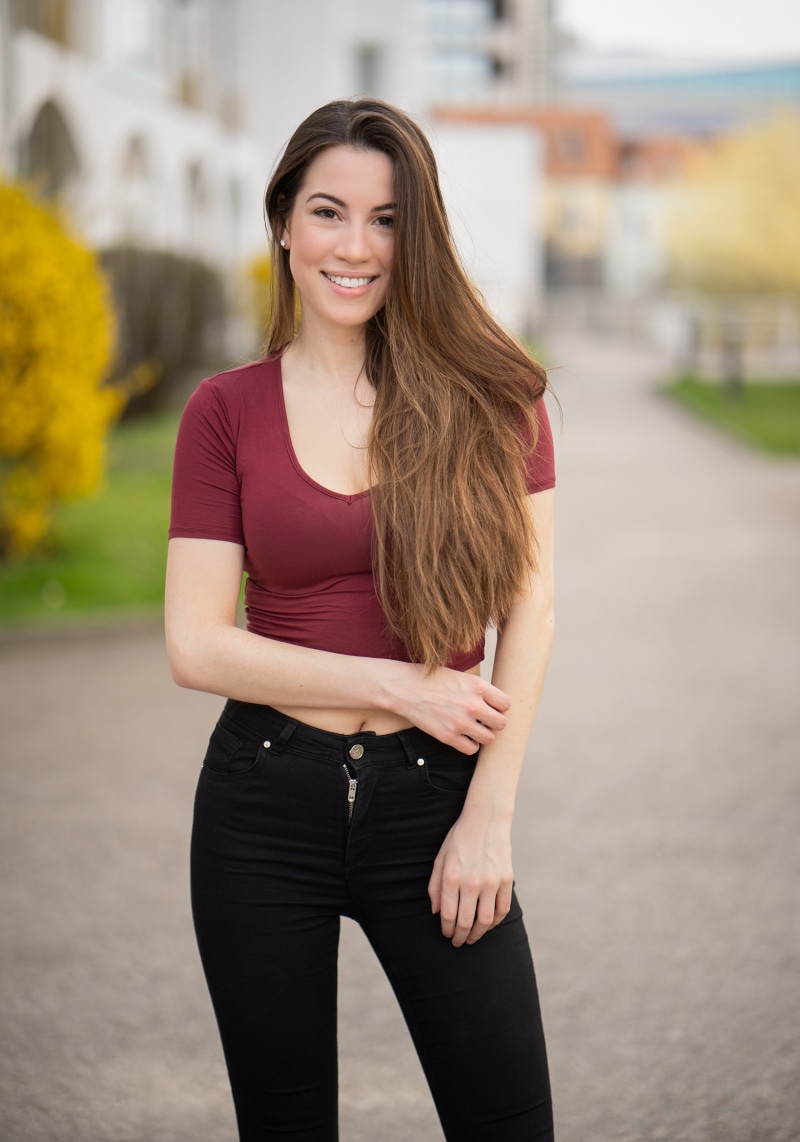 Woman with long brown hair smiling