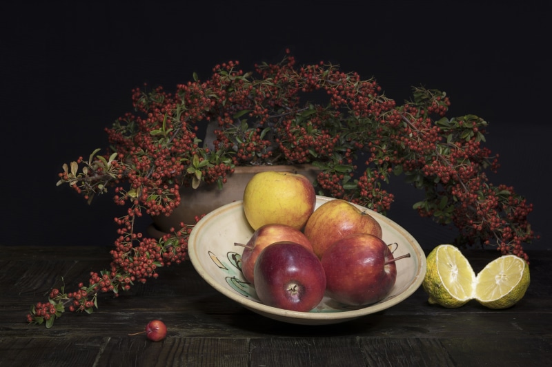 Still life with apples, lemons, and berries