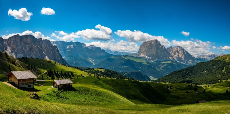 Mountain landscape with houses and clouds