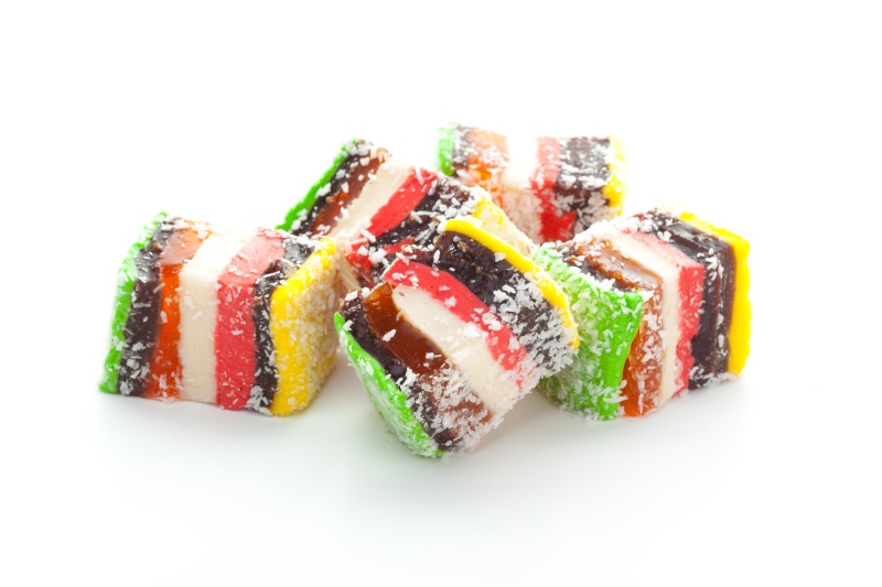 Tasty Turkish delight sweets on white background
