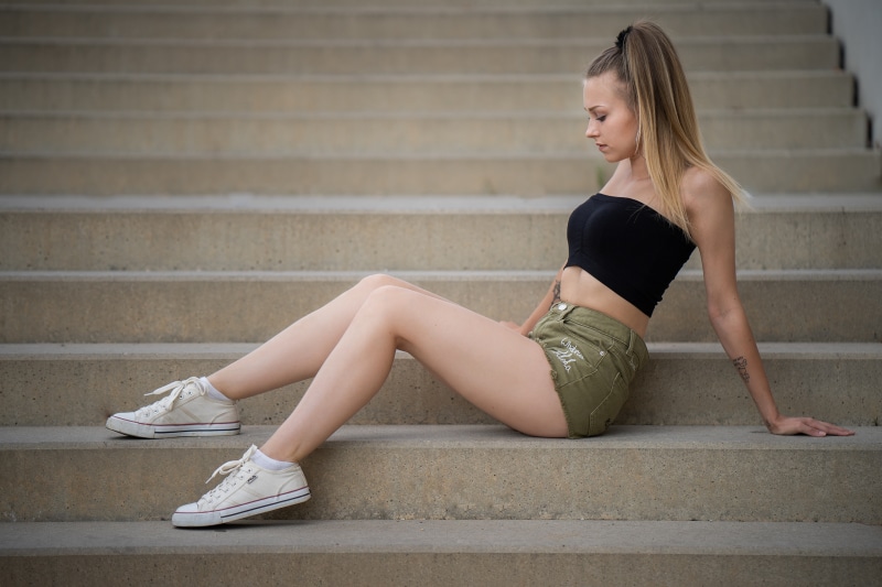 Sara sitting on stairs