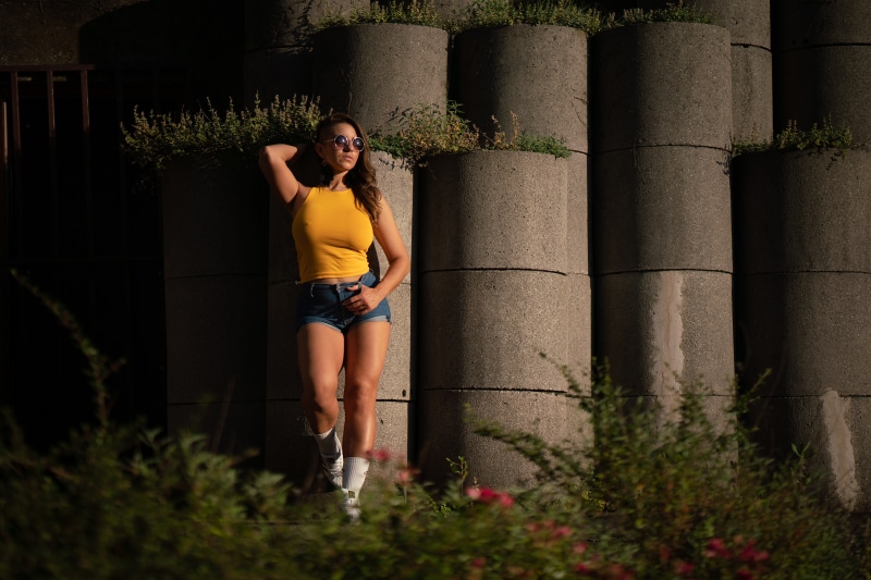 Flor Maria posing with sunglasses and shorts