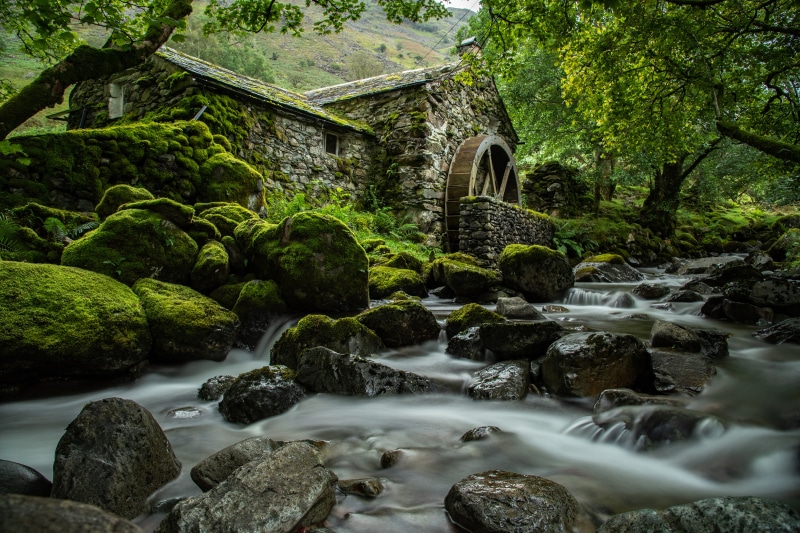 Watermill by a mossy stream in Lake District, England