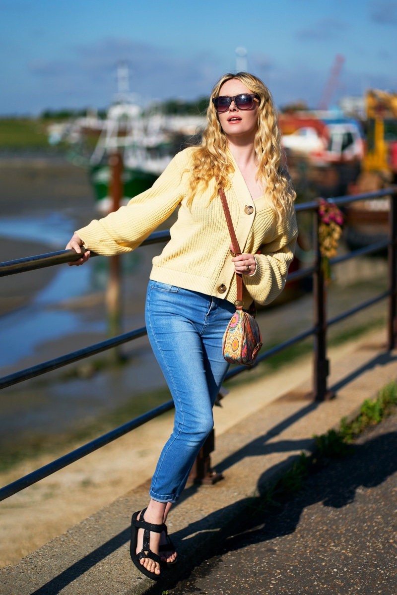 Carla Monaco wearing sunglasses and jeans