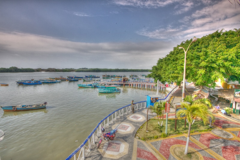 Boats docked on a river in Tumbes, Peru