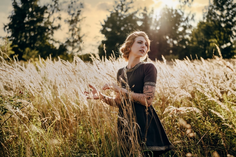 Woman in a field with tall grass