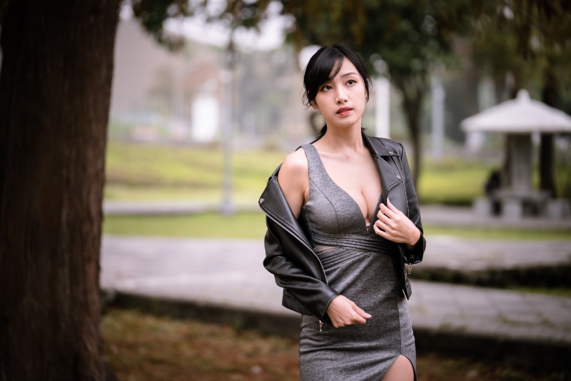 Asian woman in dress and jacket