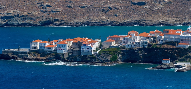 Andros Town, Greece, houses on a rocky coast