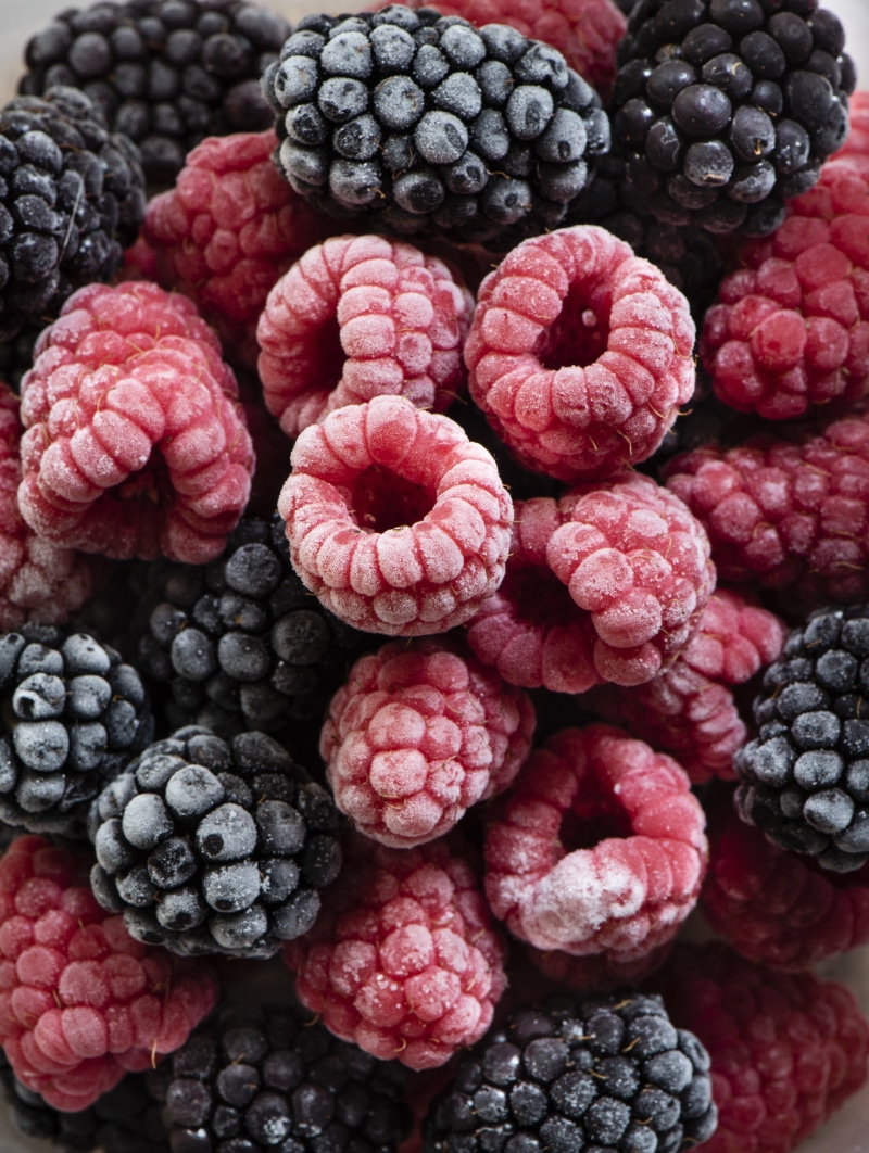 Close-up of frozen raspberries and blackberries