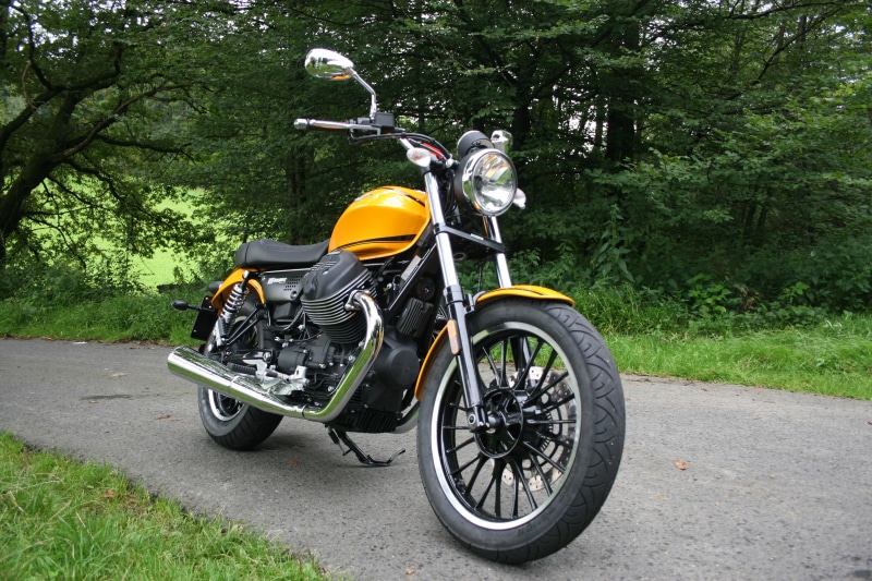 Yellow Moto Guzzi V9 Roamer motorcycle on a road