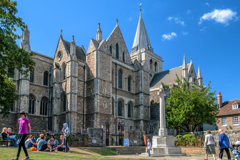 Rochester Cathedral, England with people on grass