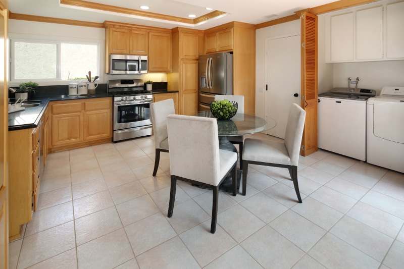 Kitchen with Dining Table and Laundry Appliances
