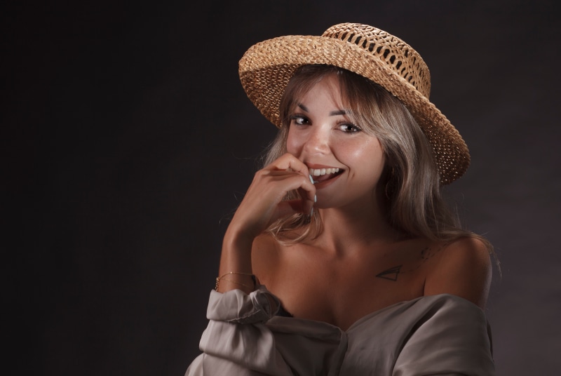 Woman with Straw Hat Smiling
