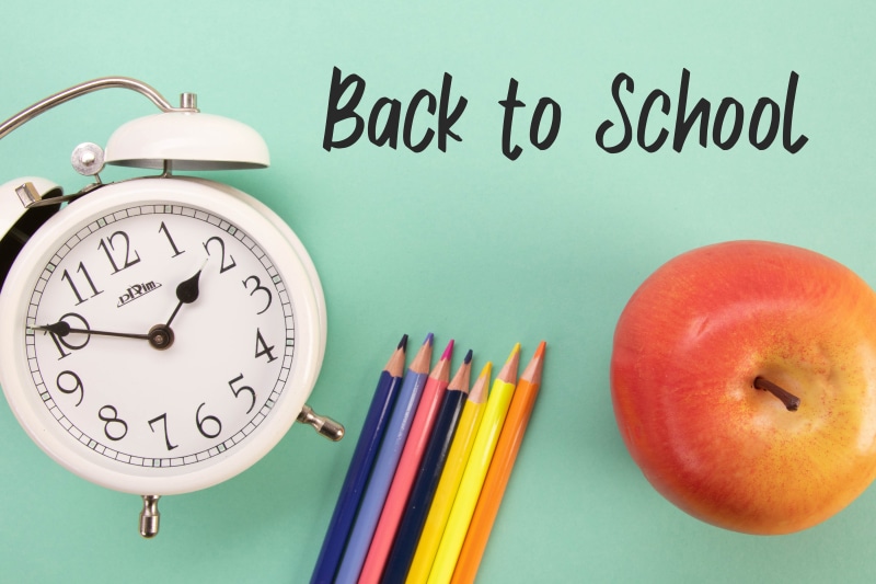 Back to School with Alarm Clock, Pencils, and Apple