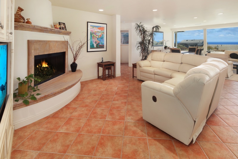 Living room with fireplace and ocean view