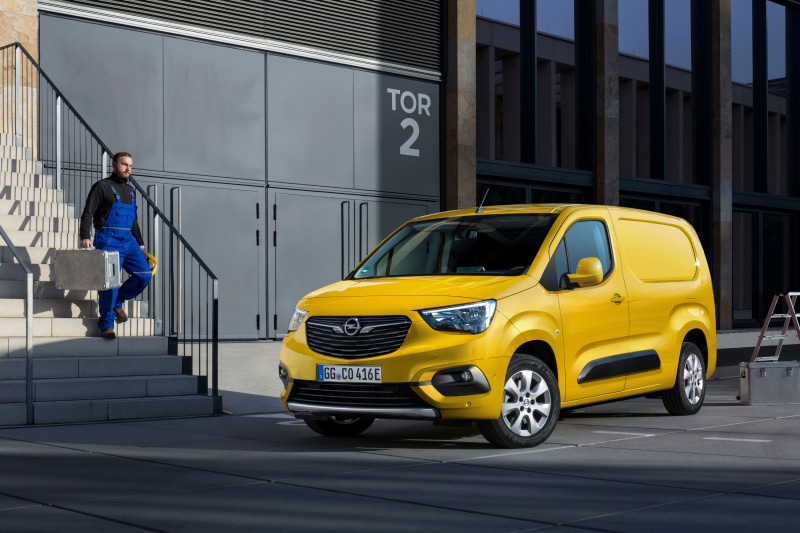 Yellow Opel Combo-e Cargo XL van with worker