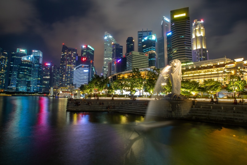 Singapore skyline with Merlion statue at night