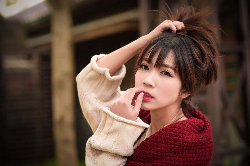 Asian woman with brown hair in a sweater