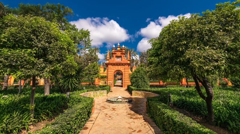 Orange Gate and Fountain in Real Alcazar Garden, Spain