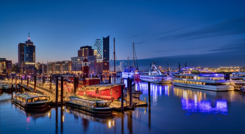 Hamburg Marinas at Dusk with Riverboats and Buildings