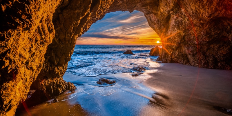Sunset viewed from a cave on the California coast