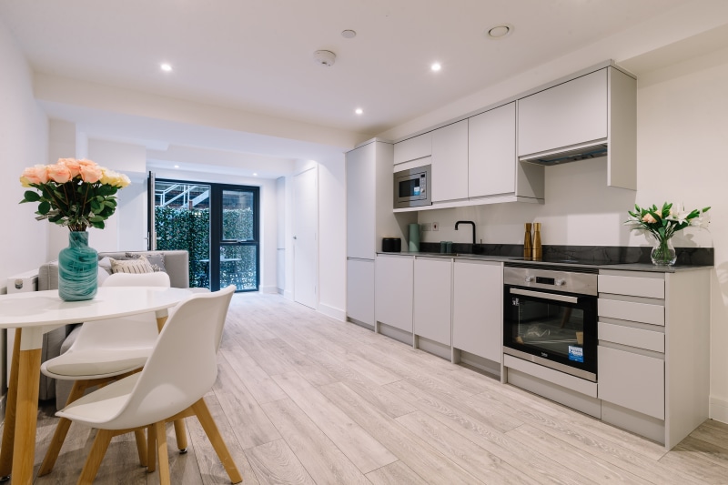 Modern kitchen and dining area with flowers