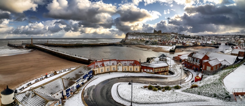 Whitby England Coastline with Lighthouses and Castle