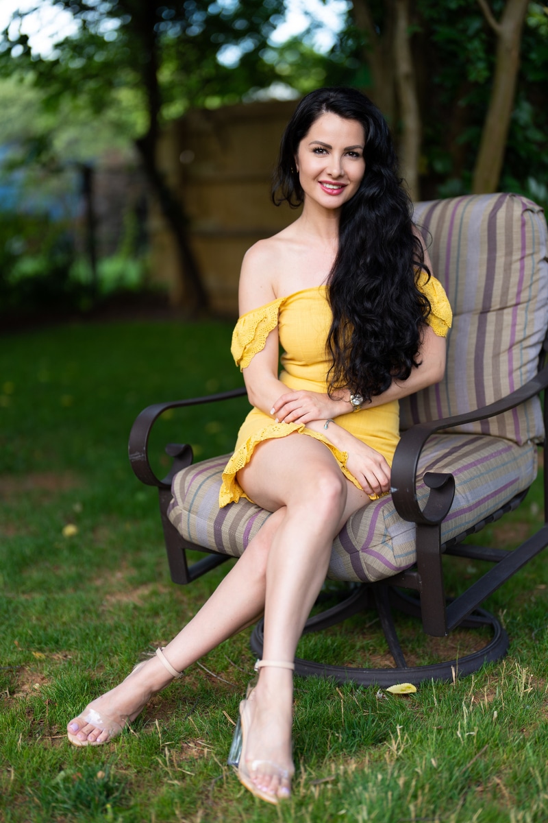 Victoria Bell sitting in an armchair outdoors