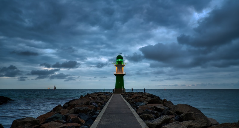 Lighthouse on a rocky pier at dusk, Germany
