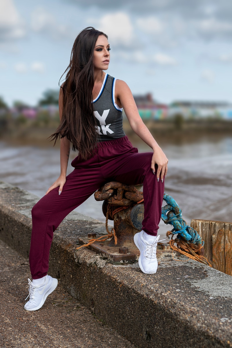 Rebecca sitting on a pier
